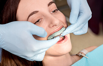 Female patient in dental chair fitted for nightguard