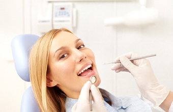 Woman smiling during dental checkup