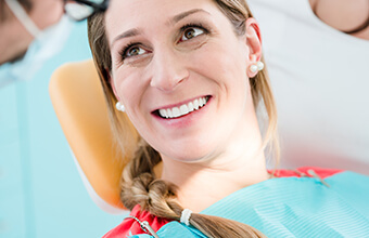 Young woman smiling in dental chair