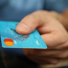 Man holding debit card