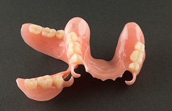 partial dentures on a black background