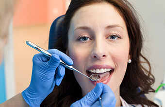 Young woman in dental chair during checkup