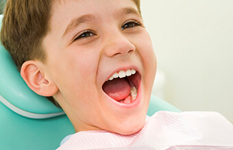 Young boy in dental chair during exam
