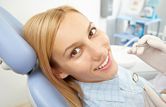 Woman in dental chair during oral cancer screening