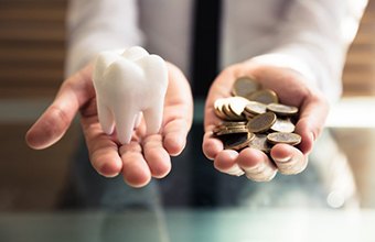 Tooth balanced with a pile of coins