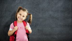 little girl with backpack